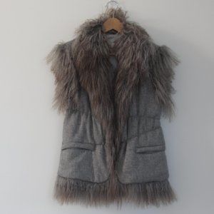 Sleeveless Jacket with fur accents.